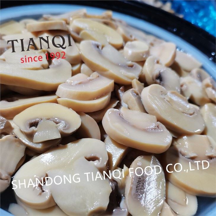 Drum packing white mushroom in vinegar